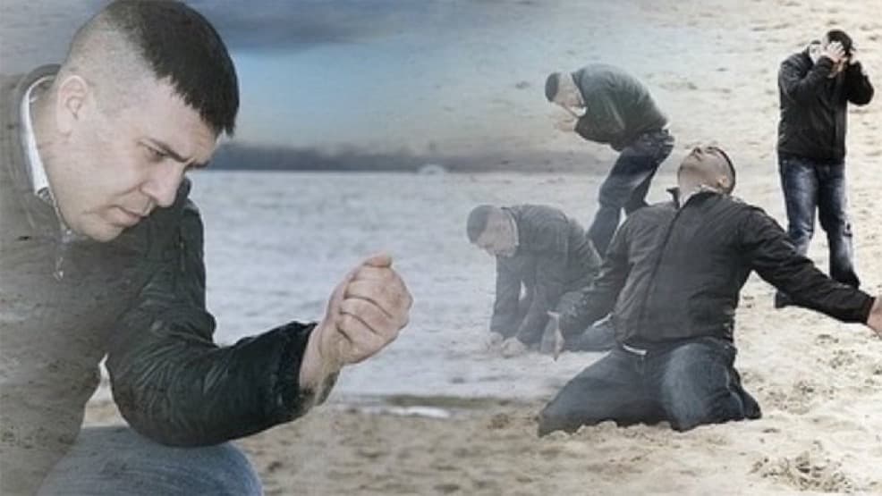 Man on the beach sad
