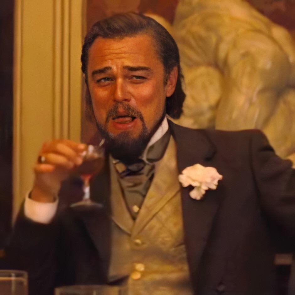 Django laughing with drink