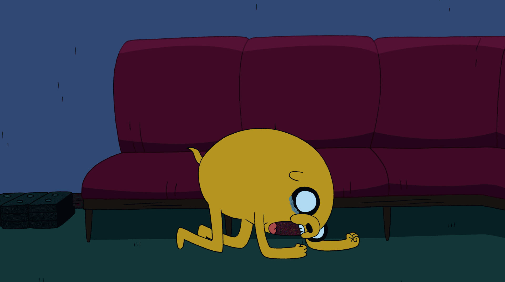 Jake eating spider under couch