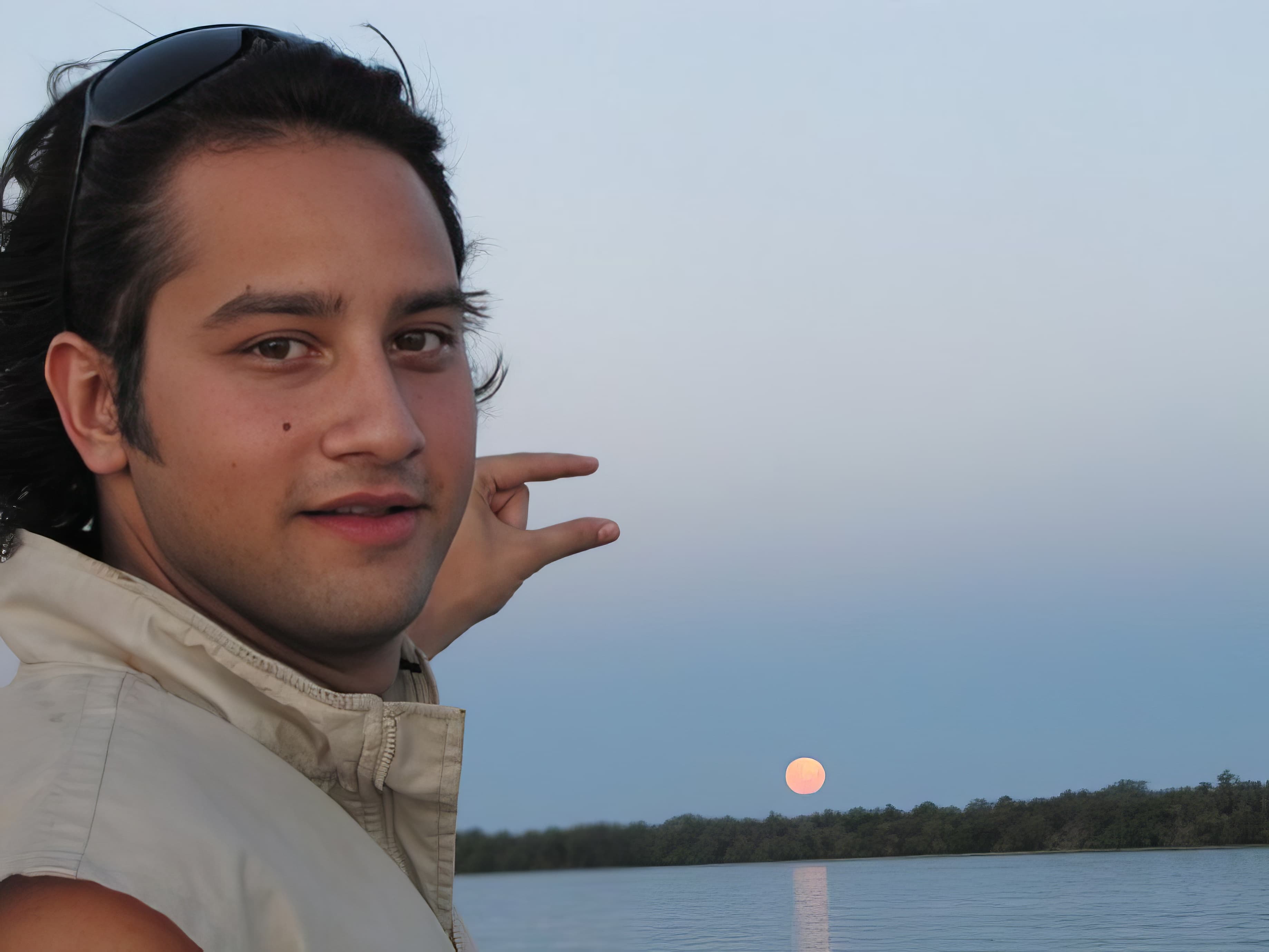 Man pinching sun